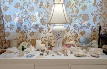 (Mostly) white rocks on white cabinet plus misc items from my past. The glass fish was a wedding present from a pet store owner in Wenatchee, the hand-colored lamp diffuser from imported light fixtures in a historical house I had in Wenatchee.